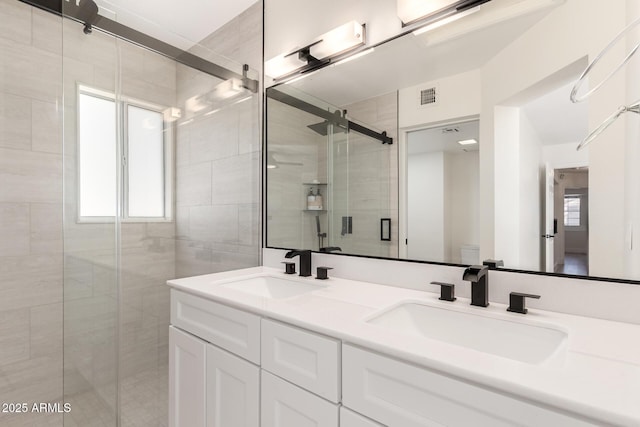 7702 W Piute Ave, Glendale, AZ 85308 - bathroom featuring a shower stall, toilet, and double vanity