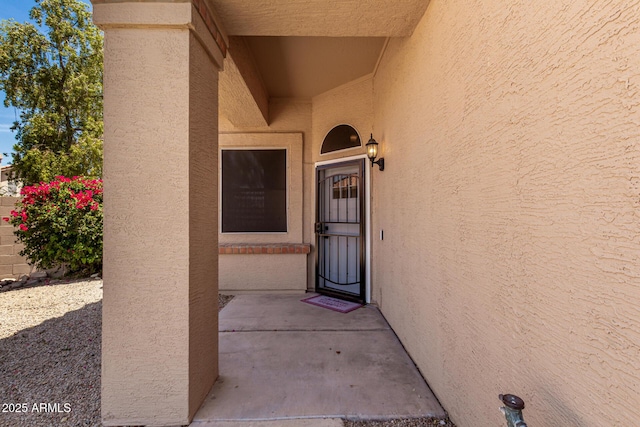 7702 W Piute Ave, Glendale, AZ 85308 - doorway to property featuring stucco siding