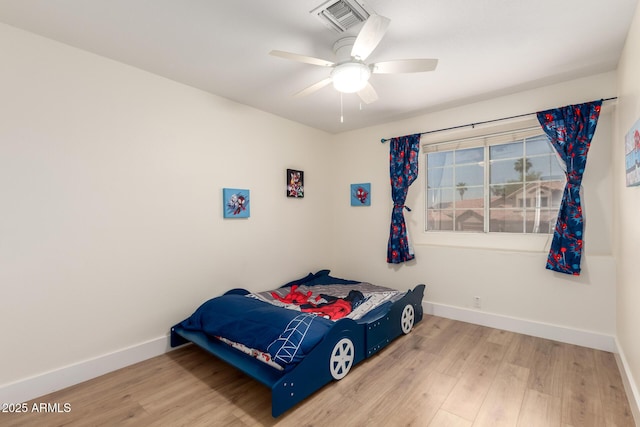 7702 W Piute Ave, Glendale, AZ 85308 - bedroom featuring baseboards, wood finished floors, and ceiling fan