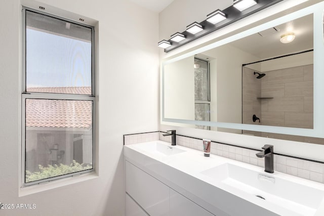 7702 W Piute Ave, Glendale, AZ 85308 - bathroom featuring backsplash and double vanity