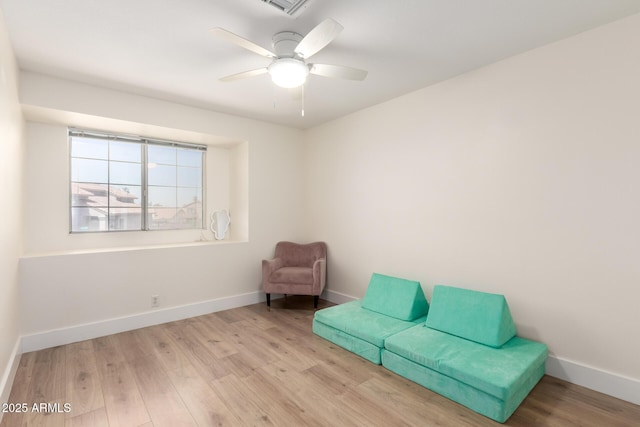7702 W Piute Ave, Glendale, AZ 85308 - living area featuring wood finished floors, baseboards, and ceiling fan