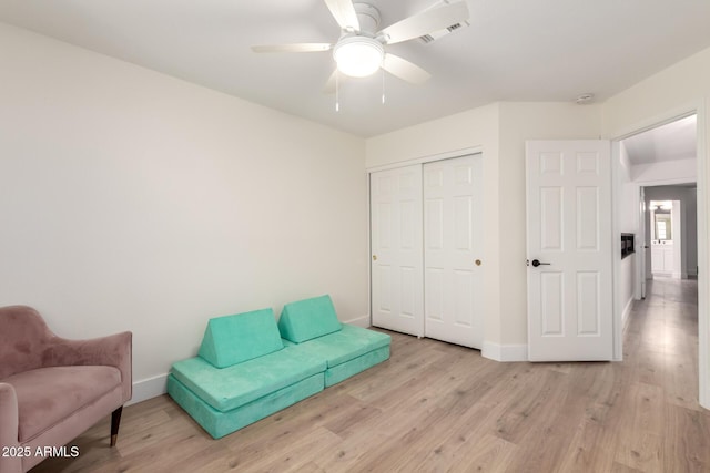 7702 W Piute Ave, Glendale, AZ 85308 - living area featuring light wood-type flooring, baseboards, and ceiling fan