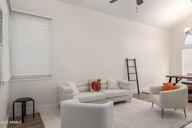 7702 W Piute Ave, Glendale, AZ 85308 - living area featuring ceiling fan, wood finished floors, baseboards, and a chandelier