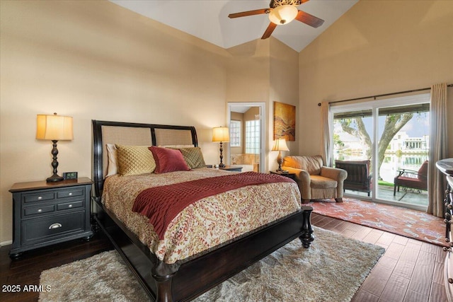 bedroom with high vaulted ceiling, access to outside, dark wood-style flooring, and ceiling fan