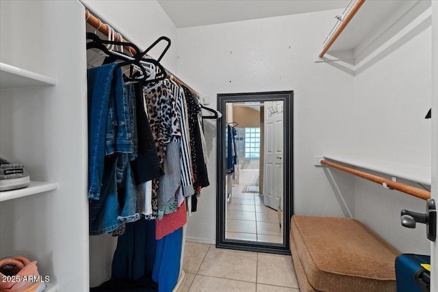 spacious closet featuring light tile patterned floors