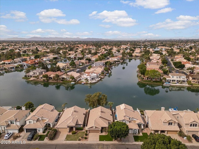 birds eye view of property featuring a water view and a residential view