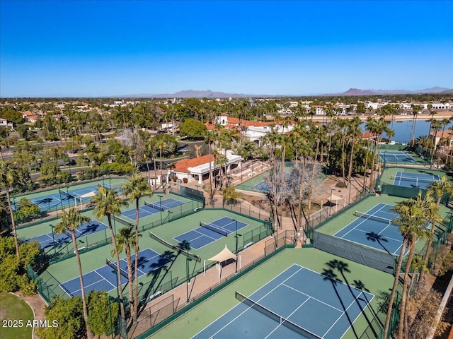 birds eye view of property featuring a water and mountain view