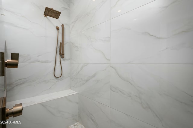 bathroom with tiled shower