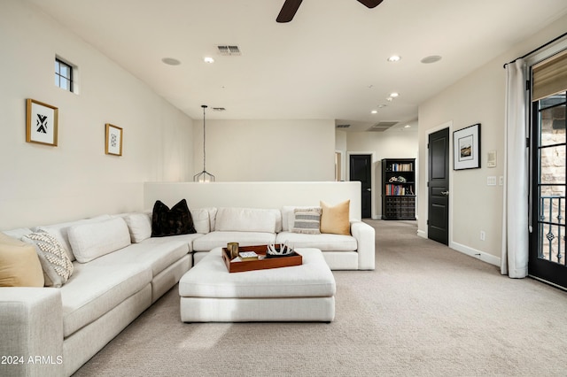 carpeted living room featuring ceiling fan