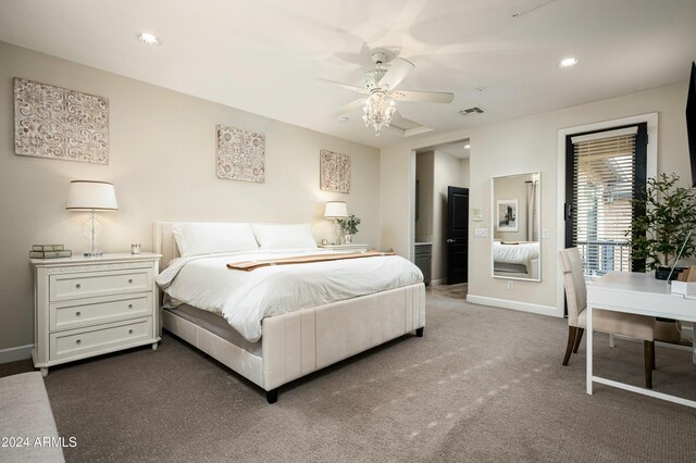 bedroom with ceiling fan and dark colored carpet