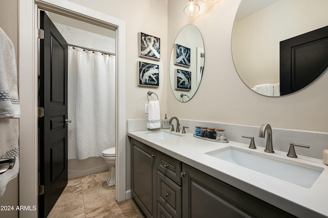 full bathroom with vanity, toilet, and shower / bath combo with shower curtain