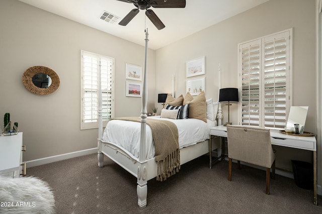 bedroom with ceiling fan and dark carpet