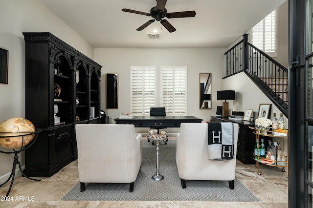 interior space featuring ceiling fan