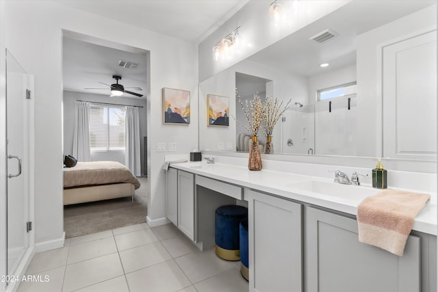 bathroom with vanity, a shower with shower door, tile patterned floors, and ceiling fan