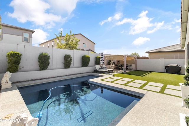 view of pool featuring a yard, a pergola, and a patio area