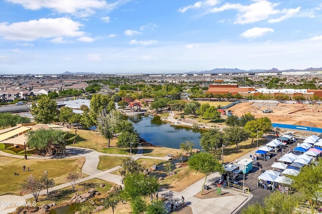 drone / aerial view with a water and mountain view