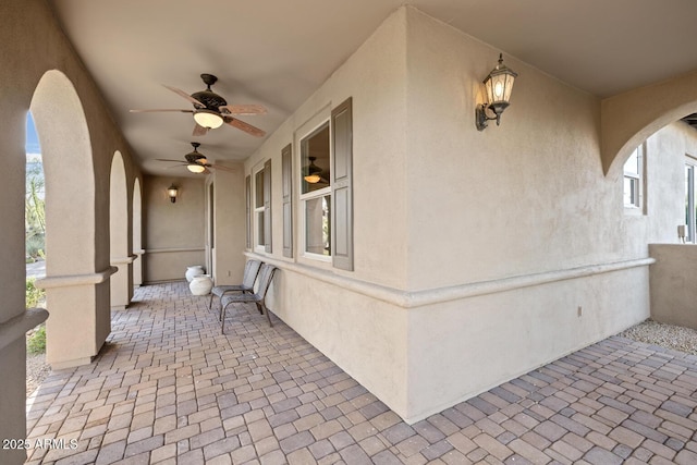 view of patio featuring ceiling fan