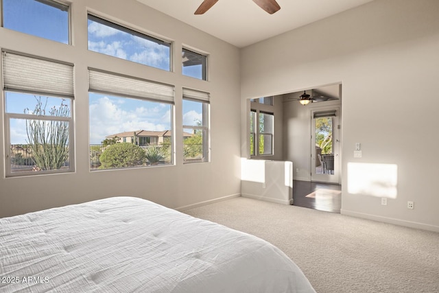 bedroom featuring baseboards, ceiling fan, and carpet flooring
