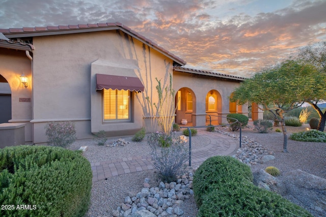mediterranean / spanish-style house featuring stucco siding