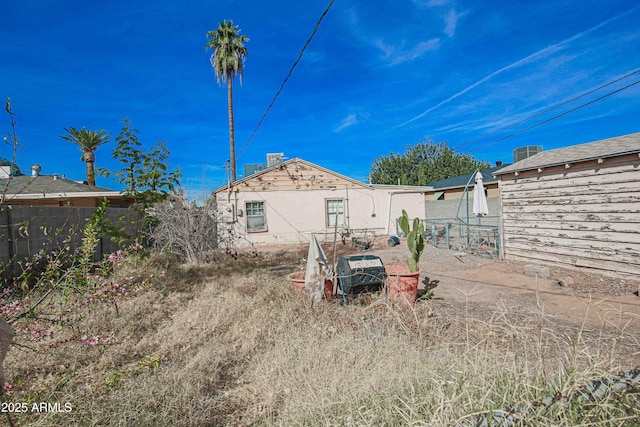 back of property with fence