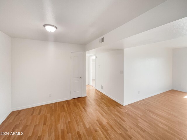 unfurnished room featuring light wood-type flooring