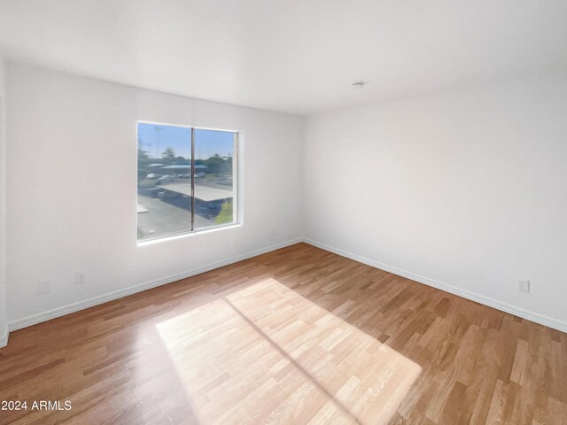 spare room featuring hardwood / wood-style floors