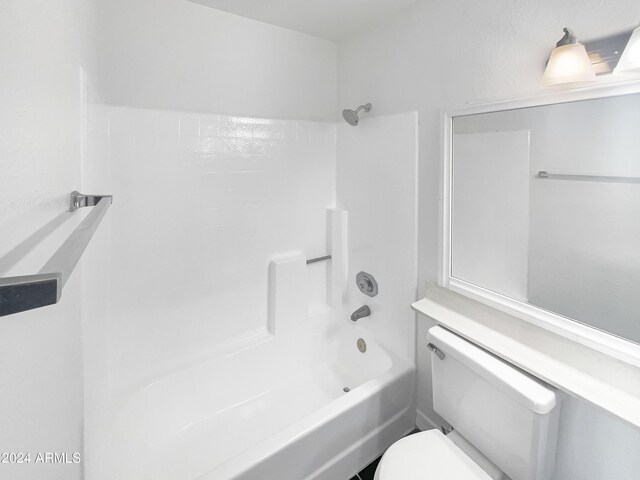 bathroom featuring  shower combination and toilet