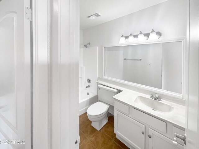 full bathroom with vanity, tile patterned floors, toilet, and washtub / shower combination