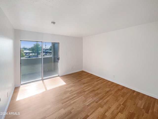 unfurnished room featuring light wood-type flooring