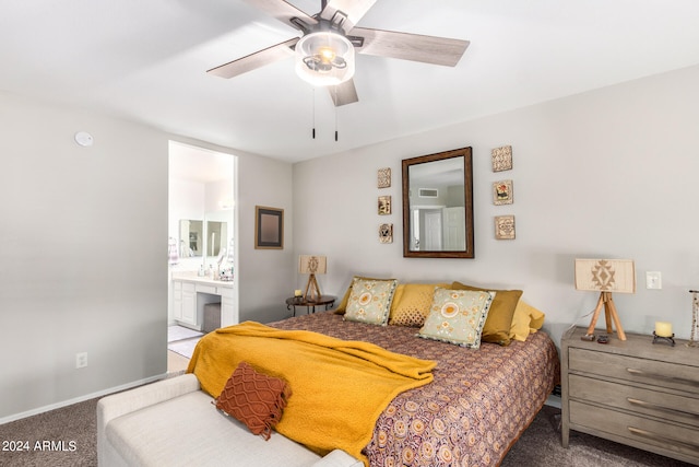 carpeted bedroom featuring connected bathroom and ceiling fan