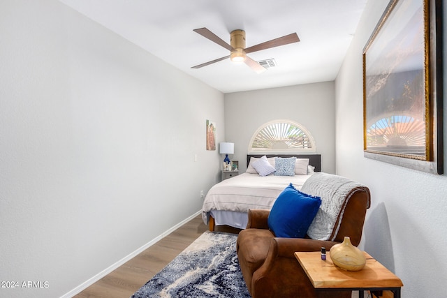 bedroom with light wood-type flooring and ceiling fan