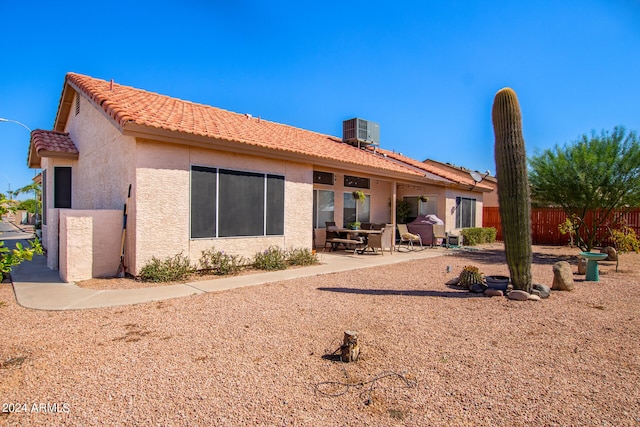 back of house featuring central AC and a patio area