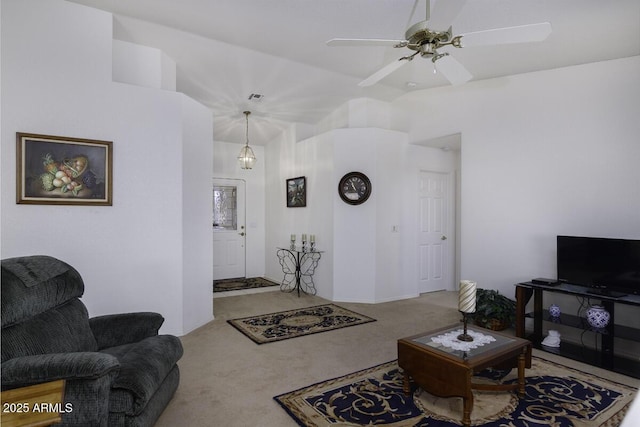 carpeted living room featuring ceiling fan