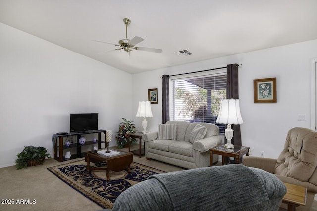 carpeted living room featuring vaulted ceiling and ceiling fan