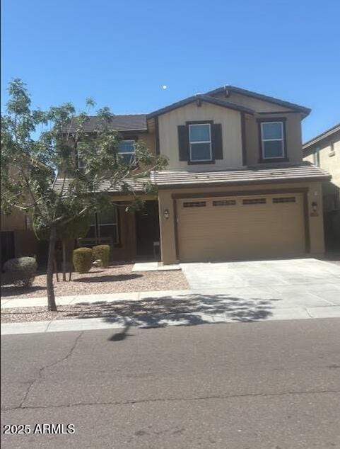 10335 W Pima St, Tolleson, AZ 85353 - view of front of property with an attached garage and driveway