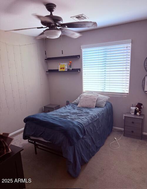 10335 W Pima St, Tolleson, AZ 85353 - bedroom featuring multiple windows, carpet, and ceiling fan