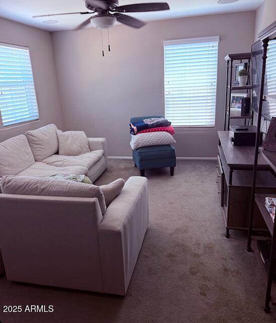 10335 W Pima St, Tolleson, AZ 85353 - carpeted living room featuring a ceiling fan and healthy amount of natural light