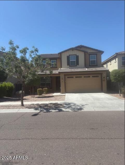 10335 W Pima St, Tolleson, AZ 85353 - view of front of home featuring a garage and driveway