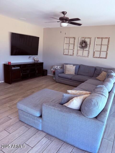 10335 W Pima St, Tolleson, AZ 85353 - living area featuring light wood-type flooring and a ceiling fan