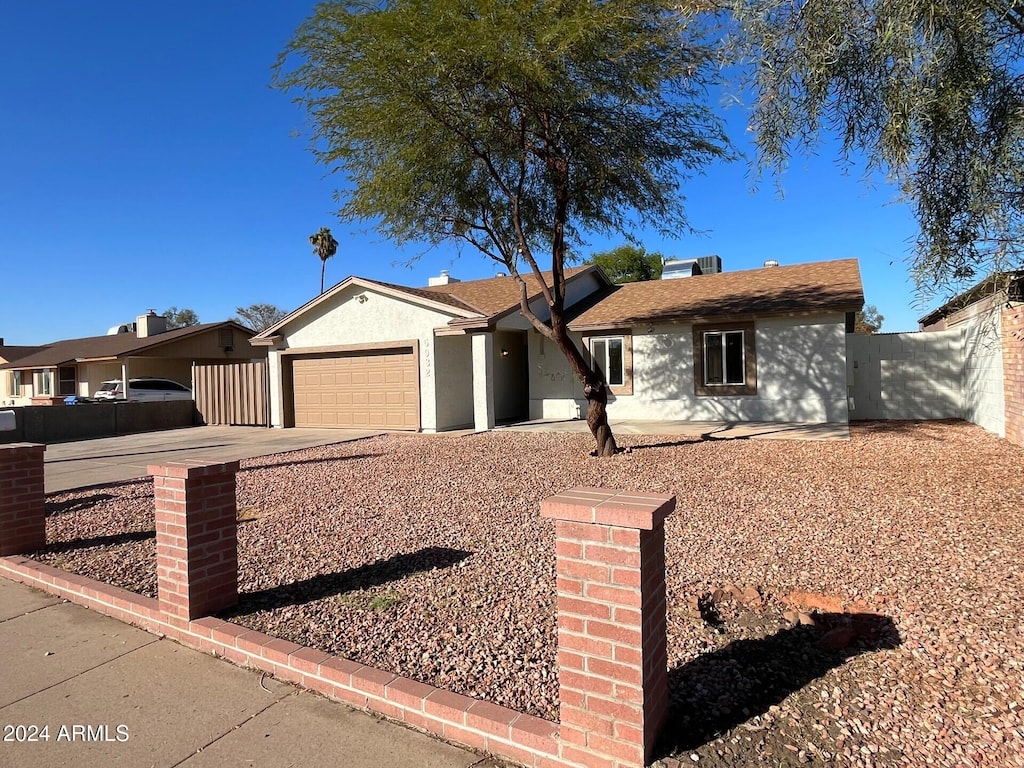 single story home featuring a garage