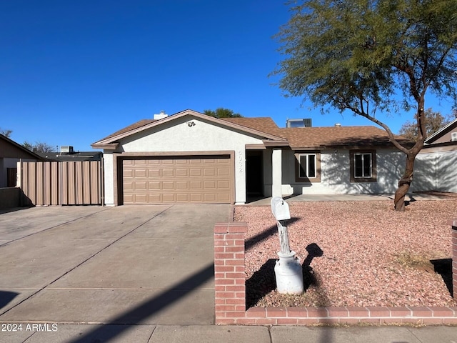 single story home featuring a garage