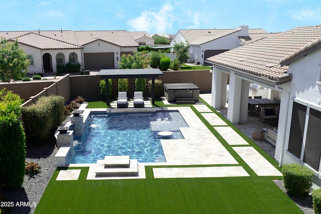 view of swimming pool with a fenced backyard, a hot tub, a patio area, and a residential view