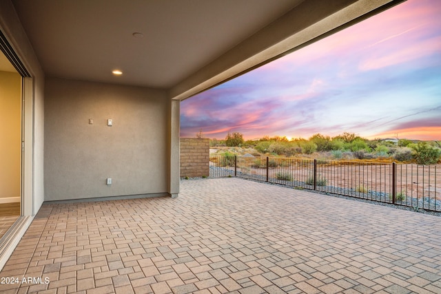 view of patio terrace at dusk