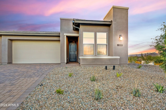 view of front of property with a garage