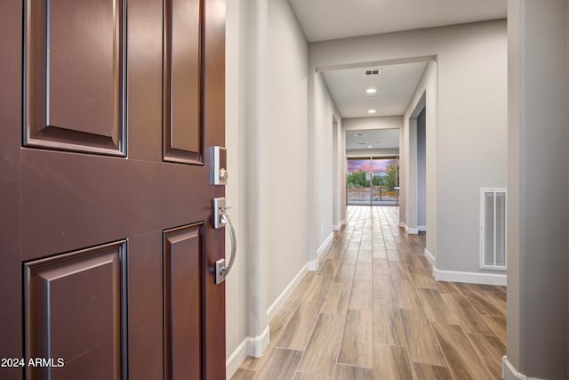 corridor featuring light hardwood / wood-style flooring