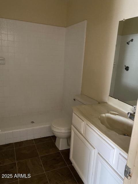 27 W Concorda Dr Unit 104, Tempe, AZ 85282 - bathroom featuring vanity, a tile shower, toilet, and tile patterned floors