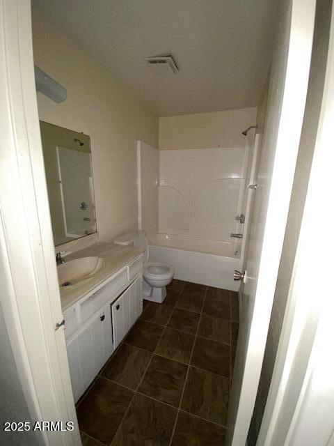 27 W Concorda Dr Unit 104, Tempe, AZ 85282 - bathroom with vanity, washtub / shower combination, toilet, and tile patterned floors