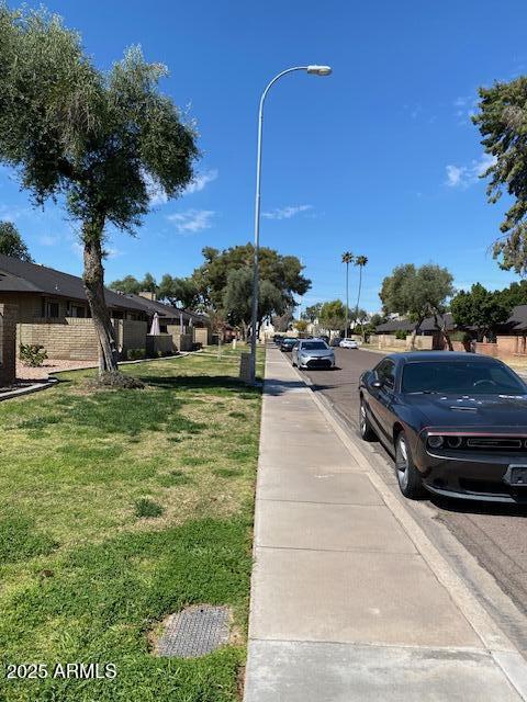 27 W Concorda Dr Unit 104, Tempe, AZ 85282 - view of asphalt road featuring sidewalks, street lighting, and curbs