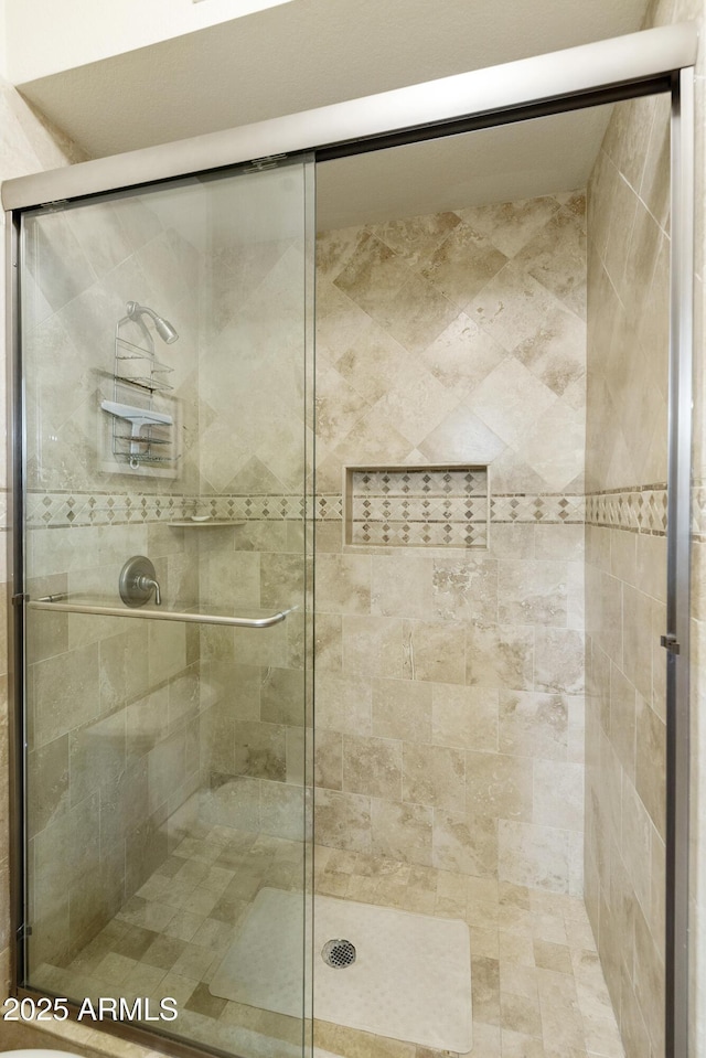 full bathroom with a stall shower