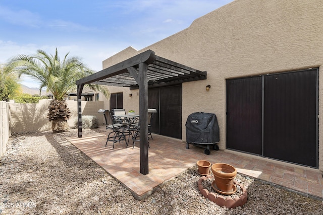 view of patio / terrace featuring outdoor dining space, a fenced backyard, a grill, and a pergola